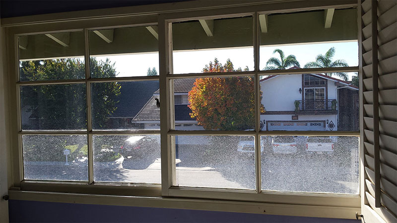 Picture of window before window cleaning in Huntington Beach by Blue Coast Window Cleaning Service.